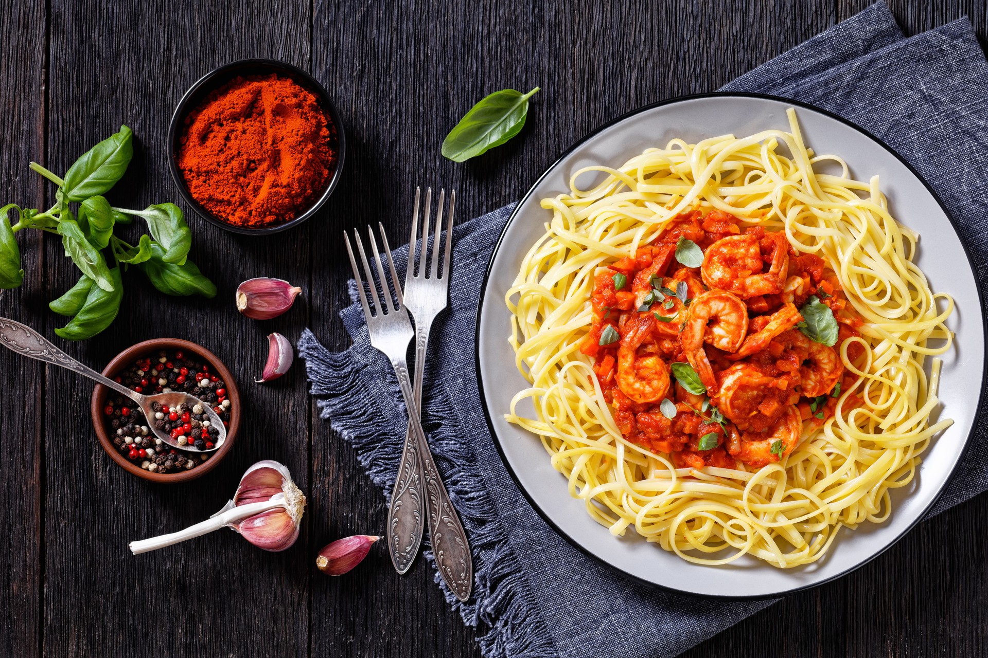 shrimps in tomato sauce with pasta, top view