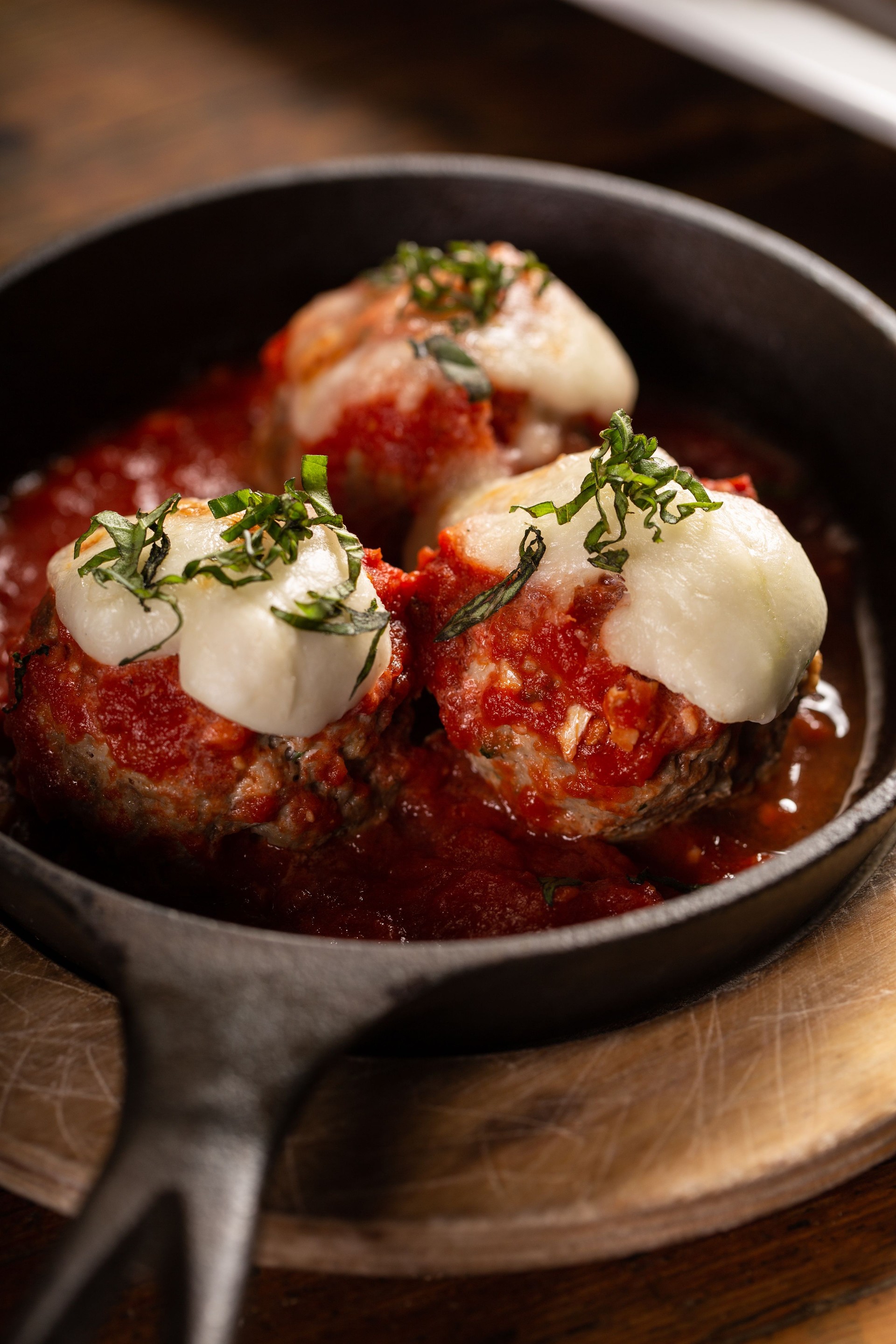 Italian meatballs served in a cast iron pan